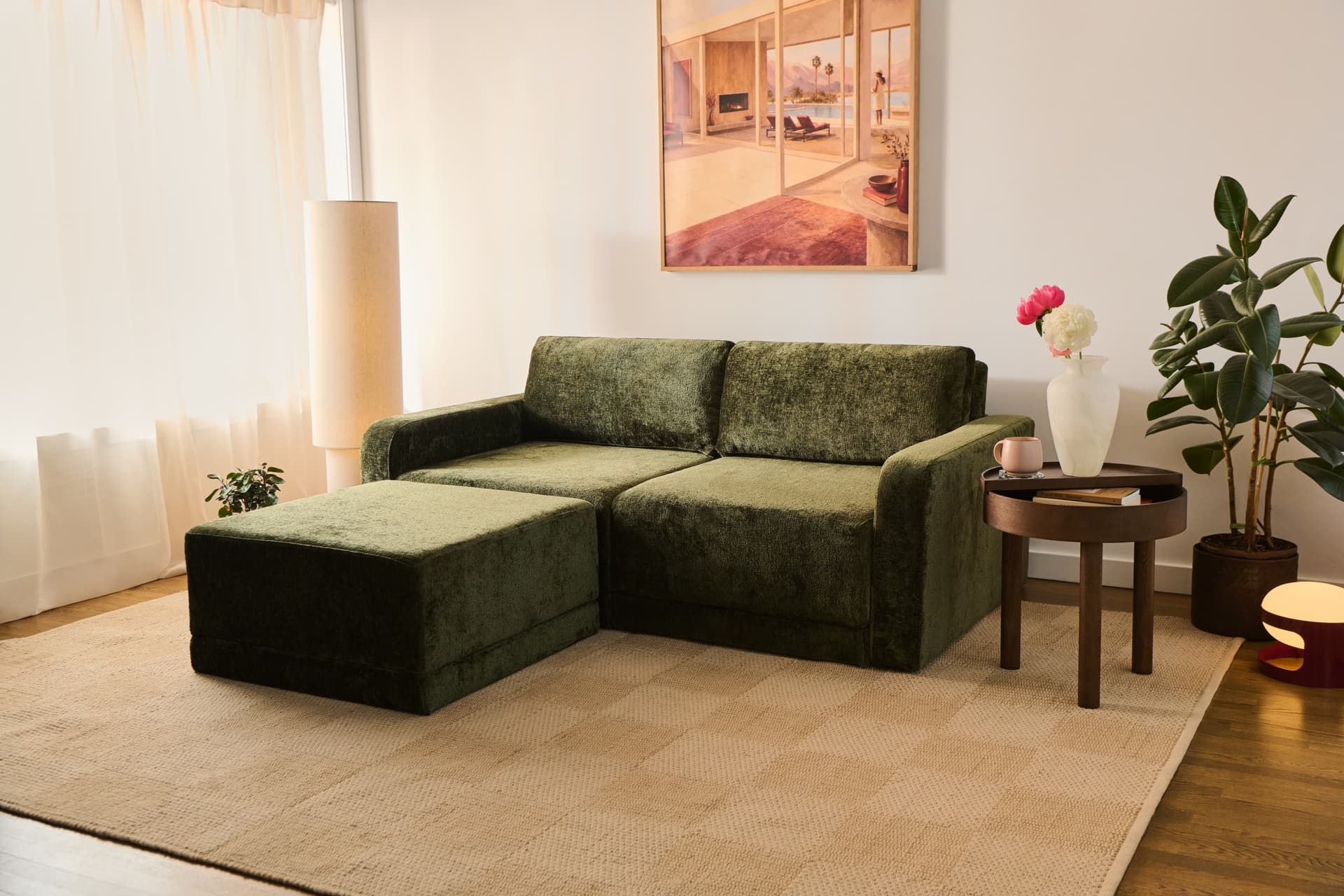 Family drawing and playing together on and around a cream Cozey Orian sectional