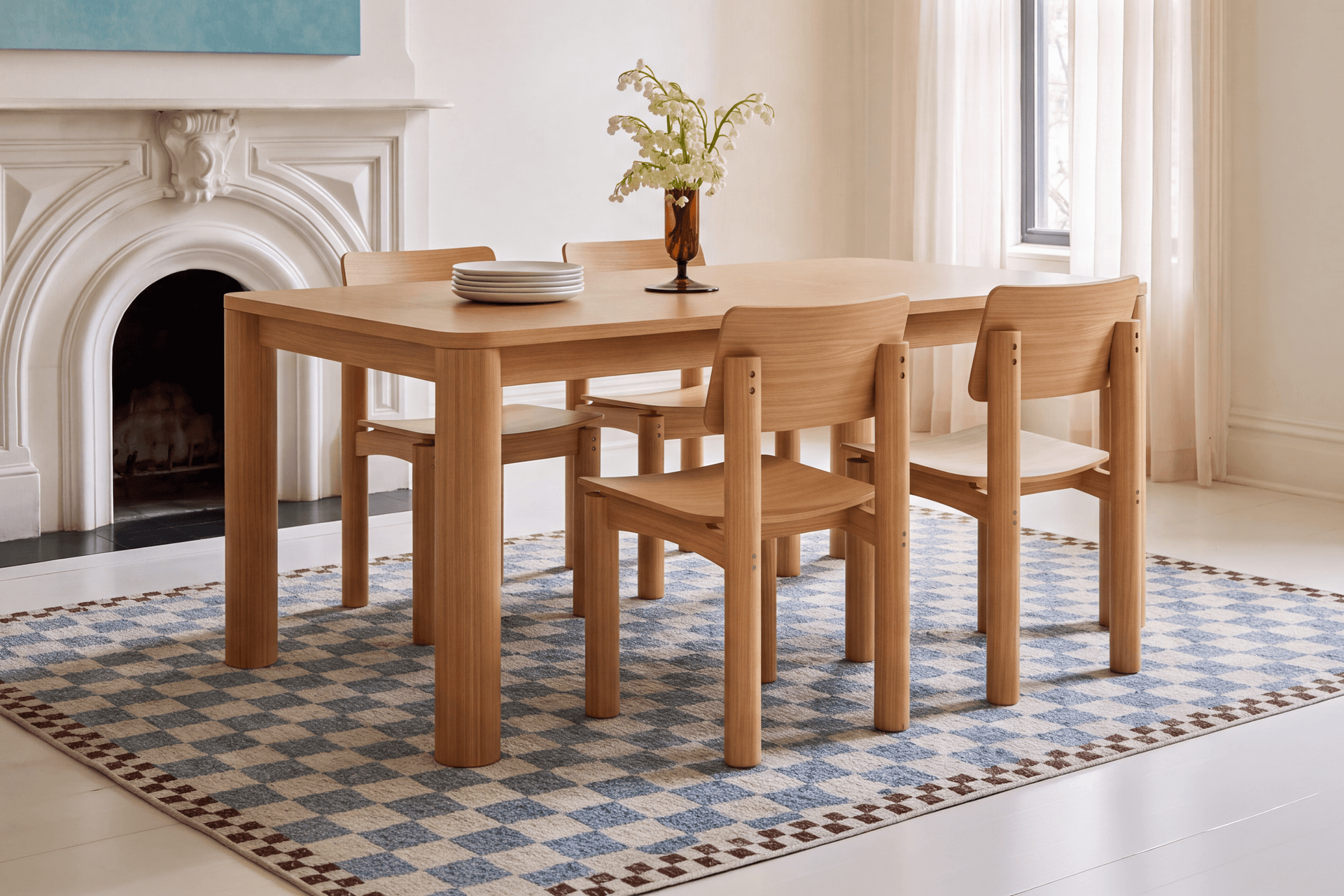 A Cozey Orsa dining table in oak with four chairs