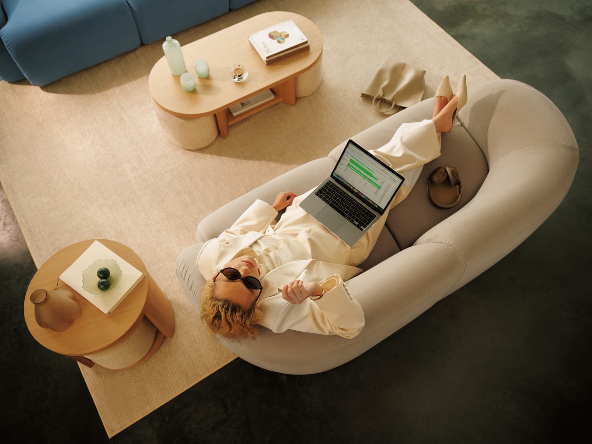 A person lounging on a Cozey sofa
